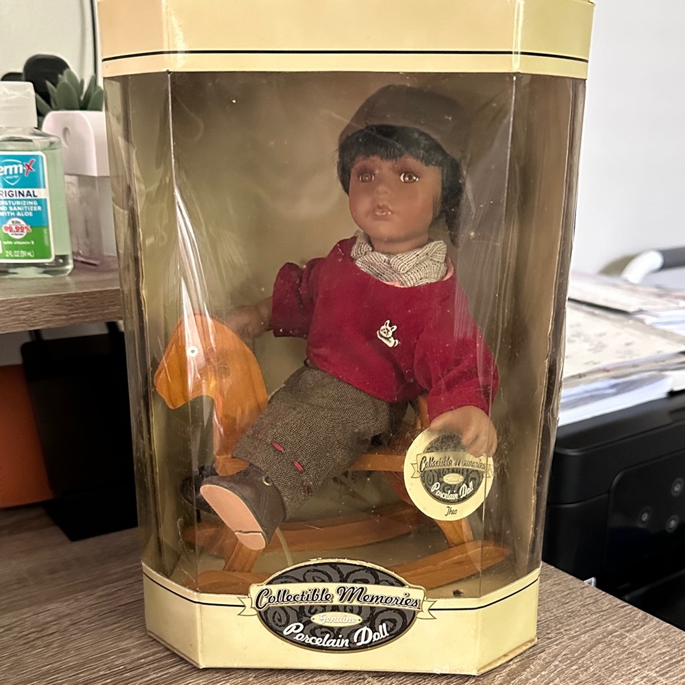 Porcelain Doll with Burgundy Sweater and Rocking Horse